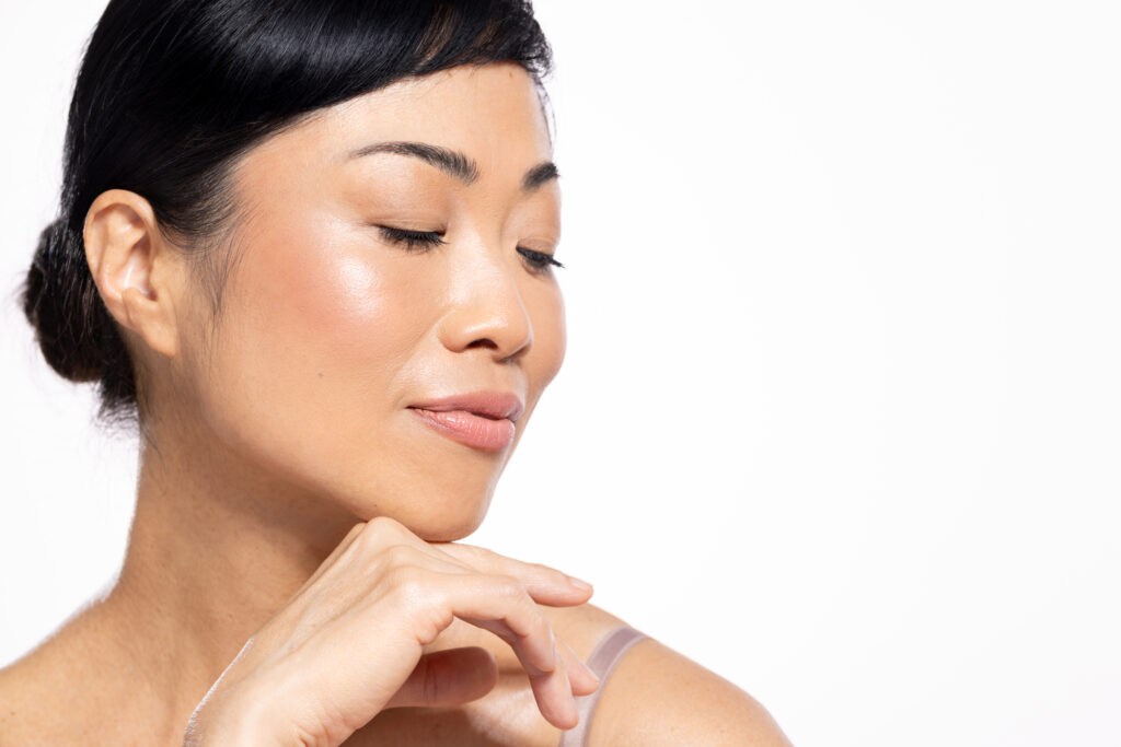 Beautiful mature Japanese woman posing against a white background Opus Plasma QA Tightens and Resurfaces Skin with minimal if any downtime Opus® Plasma Skin Tightening Treatment in Westborough, MA